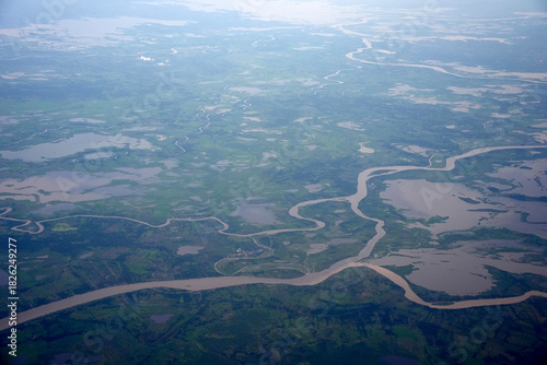 amazon river aerial view from airplane window at sunset