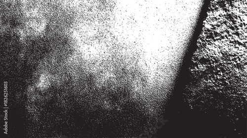 Black and white speckled texture with diagonal shadow line grainy