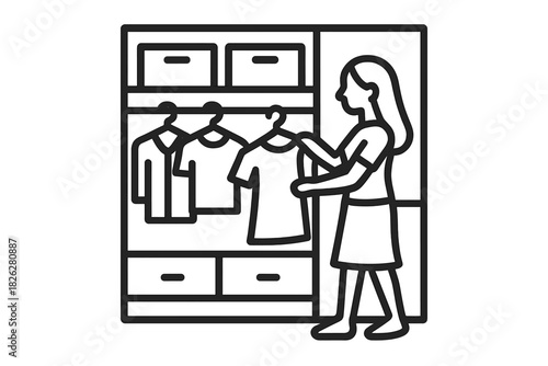 Young woman organizing belongings and selecting clothes from a modern closet