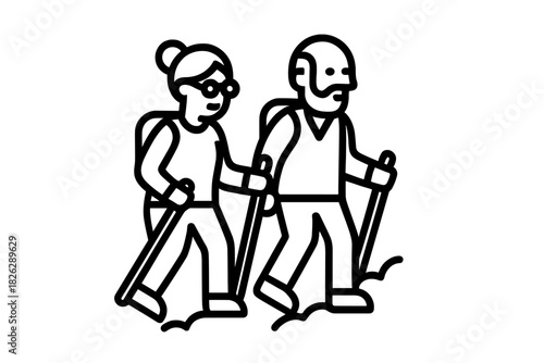 Active senior couple enjoying a hike outdoors using walking poles and carrying backpacks