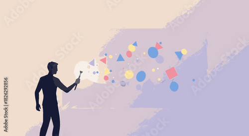 Silhouette of a creative artist painting abstract geometric shapes into reality.