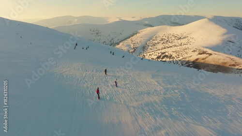 Nighttime skiing adventure scene, Alpine excursion during dusk with scenic mountain backgrounds, Collective of winter enthusiasts traversing gentle slopes under warm evening sky