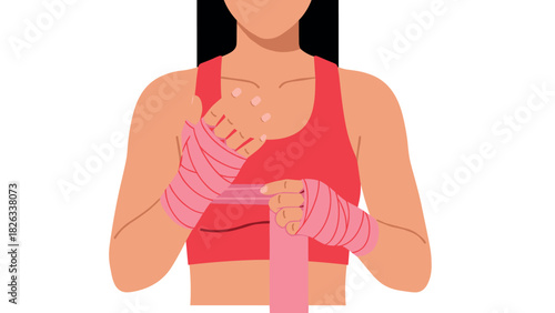 Female athlete tying hand wraps for boxing or martial arts training