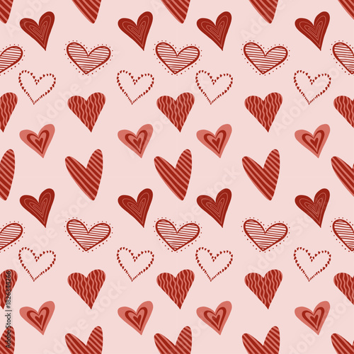Playful seamless pattern with decorative red hearts on soft pink background