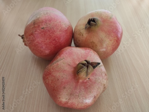 pomegranate on a wooden table