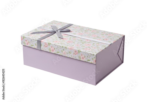 Isolated rectangular gift box with gray ribbon and floral top against a plain backdrop