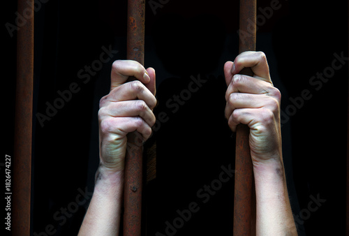 Sad young girl in prison