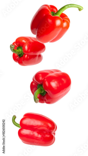 Fresh red bell peppers falling down, showing healthy eating, vegetarian diet, and organic food concepts