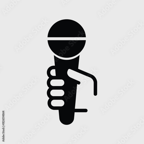 Hand holding speech microphone icon design