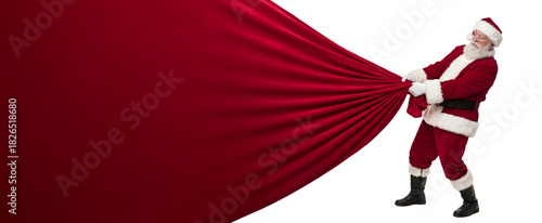 Jolly Santa Claus pulling a huge red bag filled with presents, isolated on transparent PNG background with wide copy space for holiday design use.