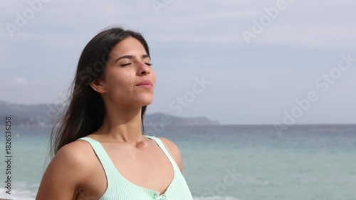 Woman breathing on the beach