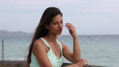 Sad woman complaining on the beach