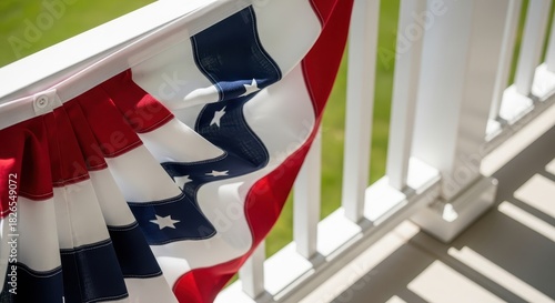 American flag bunting draped over railing on sunny day for Independence Day  