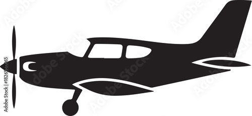 Silhouette of a propeller airplane in flight on white background.