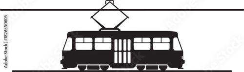 Silhouette of a modern tram moving along overhead electric wires