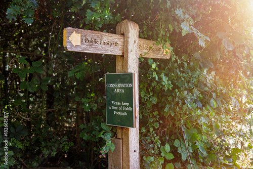 wooden footpath sign in a conservation area