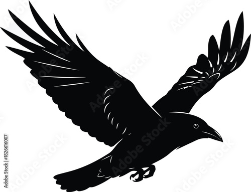 Black silhouette of a raven or crow bird flying