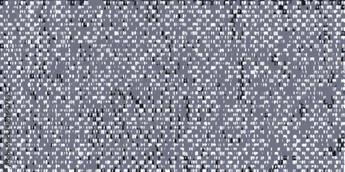 Abstract pattern of white and black marks on a gray background