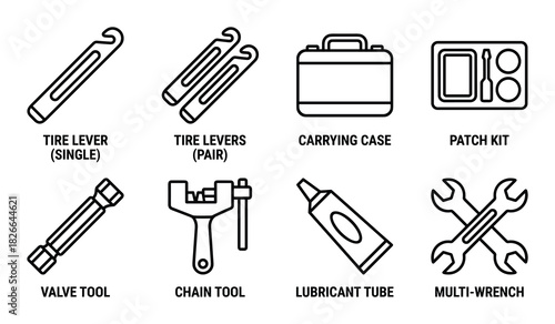 Outline set of bike repair accessories featuring single and pair tire levers carrying case patch kit and valve tool