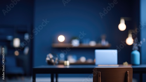 Contemporary open office space with blue interior design and laptop on wooden desk, concept for business and workplace visuals