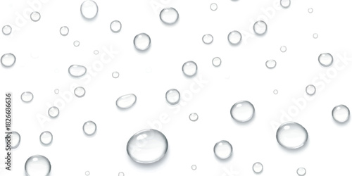 Clear water droplets on white surface, fresh liquid condensation pattern.