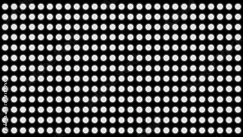 Abstract pattern of white ellipses on a black background
