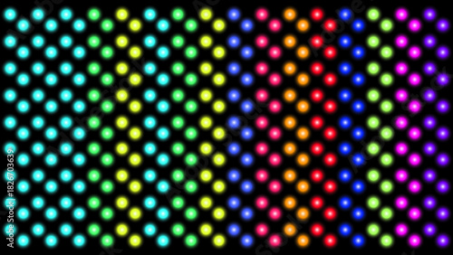 Abstract rainbow grid of blurry lights on black background