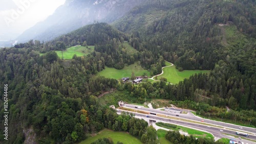Drone turn showing motorway, Salzach River and Werfen Castle hill
