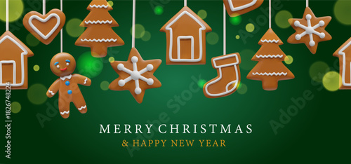 Christmas banner featuring hanging gingerbread cookies shaped like trees, stars, houses, hearts, stockings, a gingerbread man, with icing. The cookies appear against a deep green festive background