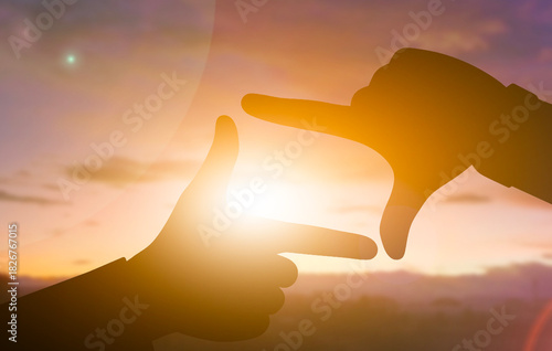 Framing the Sunset Through Creative Hands Silhouette