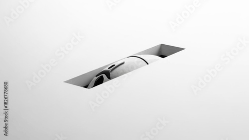 Close-up shot of a sleek, modern recessed lighting fixture against a plain white background with neutral tones.