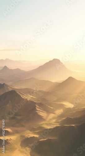 Golden sunlight bathing rugged mountain peaks, casting warm glows across pristine alpine landscape during early morning hours, revealing serene wilderness beauty
