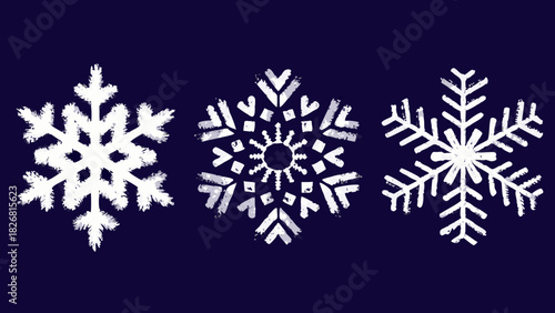 Three white snowflakes on a dark blue background