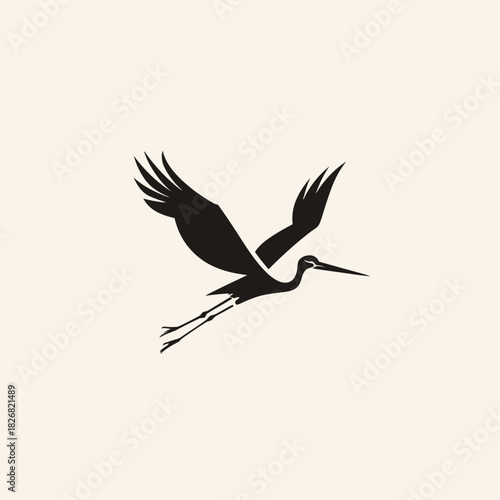 Elegant flying stork or crane silhouette vector graphic design. Minimalist black bird with outstretched wings on a light background.
