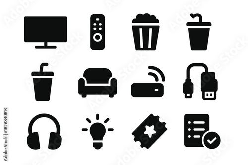 Home Theater Icons. Home theater. Solid icon set of Home theater: TV screen, remote control, speaker, popcorn, soda, sofa, streaming device, HDMI cable,