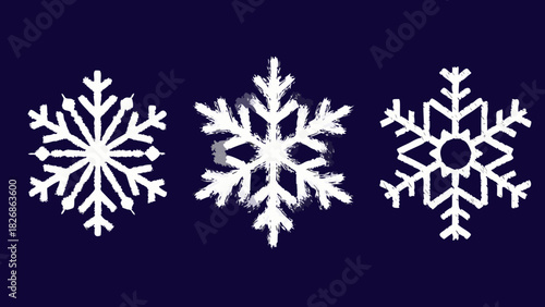 Three white snowflakes on a dark blue background