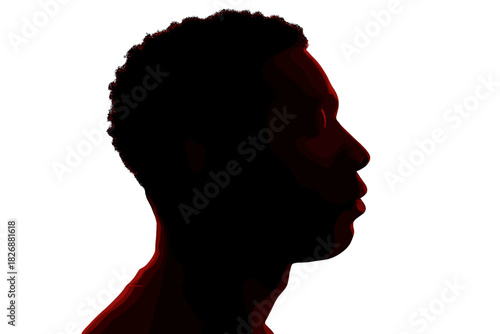 High contrast profile portrait of a young Black man in deep shadow against a bright background