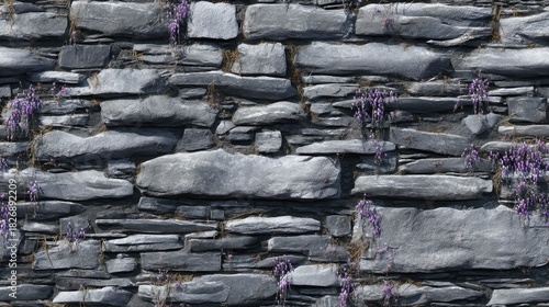 Rustic stone wall adorned with ivy and purple flowers for traditional design elements in backdrops