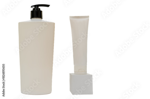 A white plastic container with a black dispenser cap on a white background. Cosmetic cream on a podium.