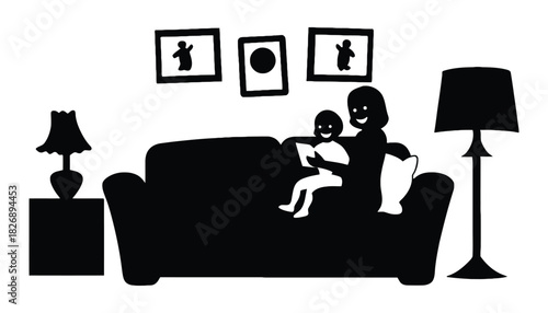 Silhouette of mother and child reading on sofa with lamps and pictures