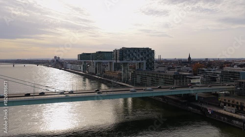 Wallpaper Mural Aerial view tracking left across Rhine river in Cologne, Germany, showing modern Kranhauser buildings and Severinsbrucke bridge Torontodigital.ca