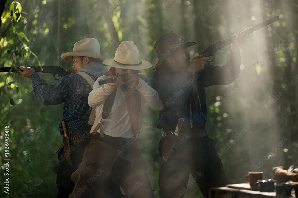 Naklejka premium Group of cowboys aiming rifles in a forest camp, with sunlight streaming through the smoke
