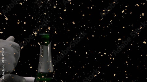 Gloved hand contacting foil cage, loosening and popping cork to celebrate, gold confetti falling