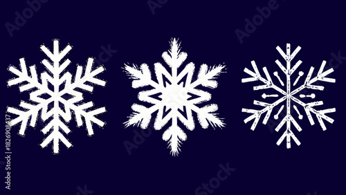 Three white snowflakes on a dark blue background