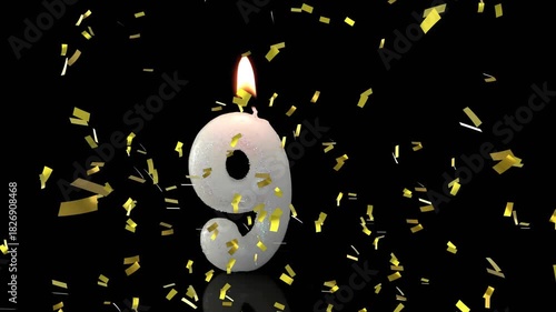 Hand holding lit match igniting wick causing gold confetti swirling and celebrating number 9 candle