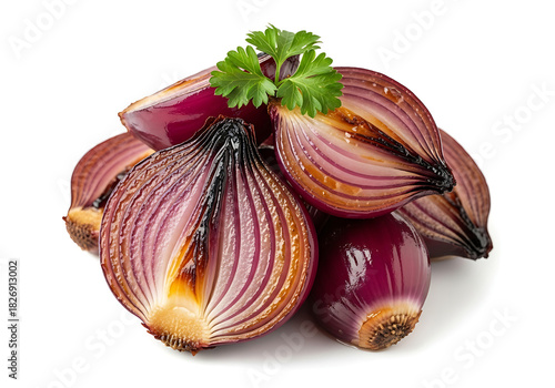 Roasted red onions halved with fresh parsley garnish on white background