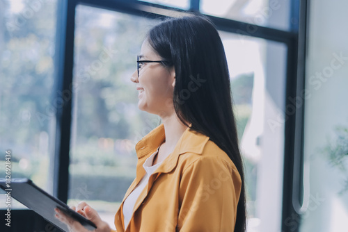 Business woman using calculator for do math finance on wooden desk in office and business working background, tax, accounting, statistics and analytic research concept.