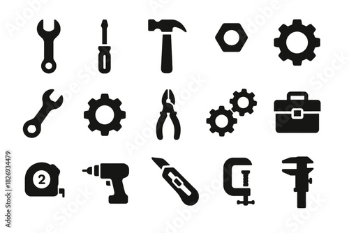 Set of black silhouette tools and icons including wrench, screwdriver, and gears