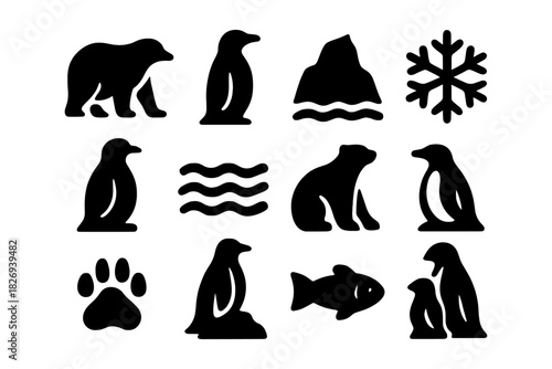 Silhouette arctic animals and elements icons set with penguin, bear, fish, and snowflake