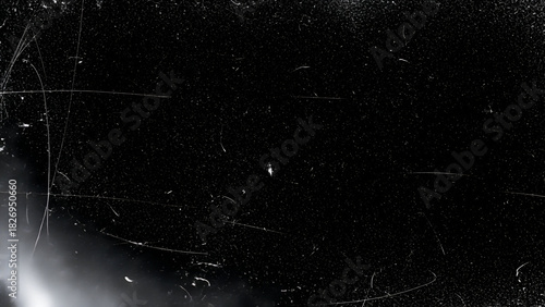 Black background with white scratches and dust particles